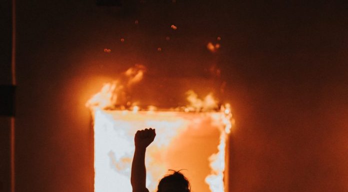 The Wind Blows Hard Against His White Fence