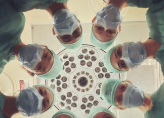 Radiation Oncology people in white shirt holding clear drinking glasses