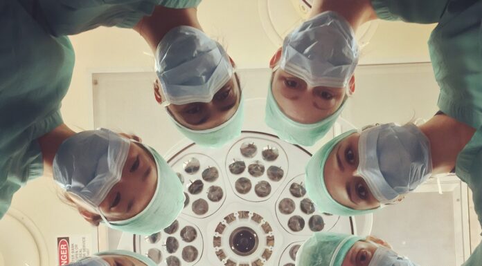 Radiation Oncology people in white shirt holding clear drinking glasses