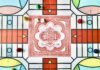 Parcheesi red white and green floral textile
