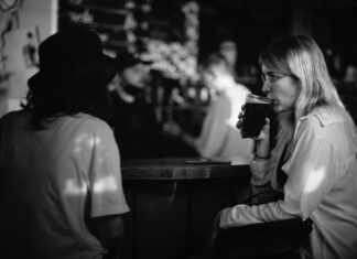 After Seeing You in Sullivan’s grayscale photo of woman drinking from cup
