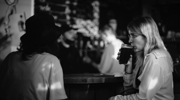 After Seeing You in Sullivan’s grayscale photo of woman drinking from cup