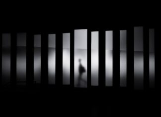 City of peace grayscale photo of person running in panel paintings