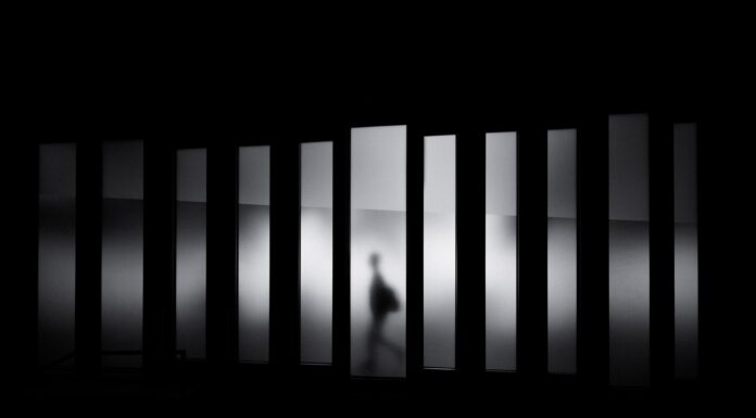 City of peace grayscale photo of person running in panel paintings