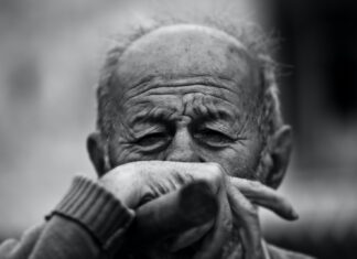 COUNTRY LIFE man grayscale photo