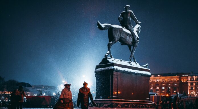 The year of the tyrant’s final spring two person walking near person riding horse statue