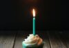 On my 44th birthday taper candle on cupcake