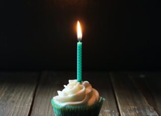 On my 44th birthday taper candle on cupcake
