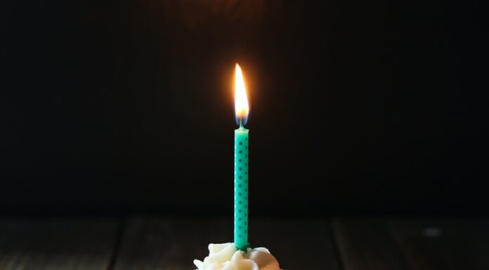 On my 44th birthday taper candle on cupcake