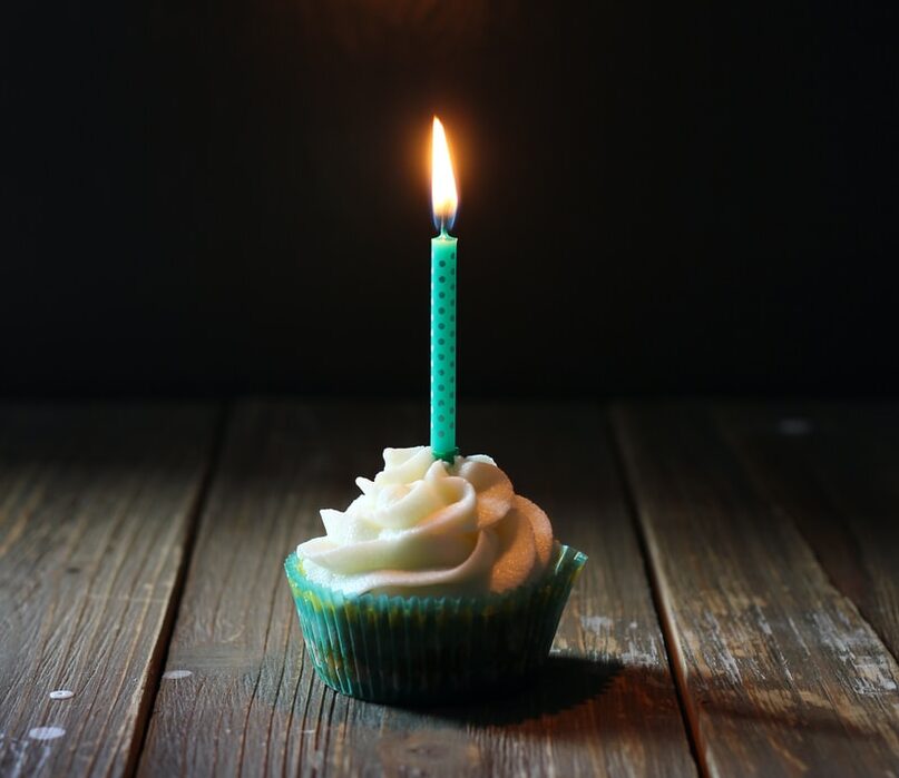 taper candle on cupcake