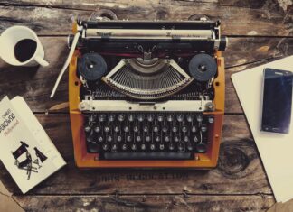 HEY BUK brown and black typewriter