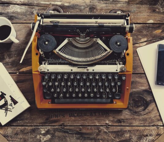 HEY BUK brown and black typewriter