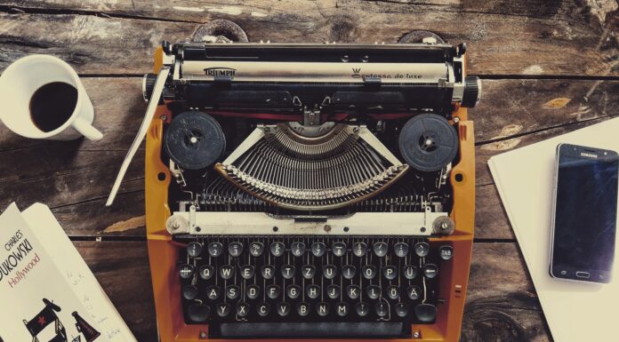 HEY BUK brown and black typewriter