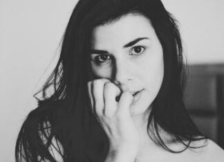 Hips like there’s no water near grayscale photo of woman with hand on her face