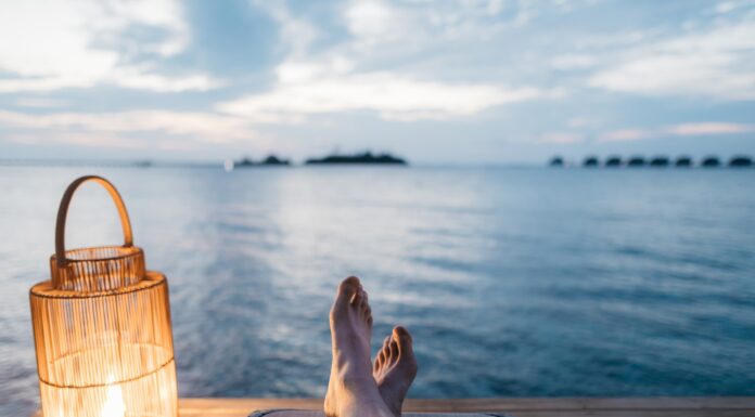 When We Were Poets person lying on chair and facing on body of water