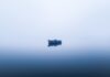 cool air warm water boat on ocean