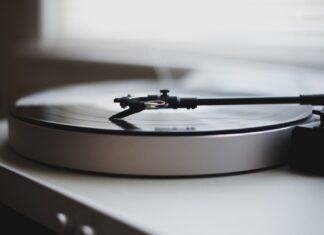 Billy Joel tilt shift lens photography of gray and black turntable