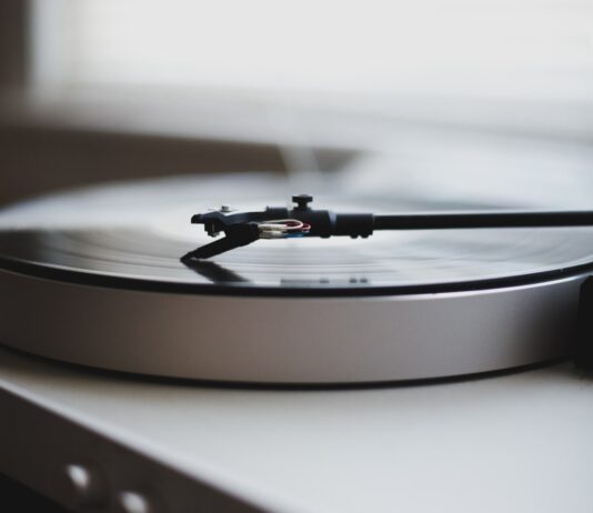 Billy Joel tilt shift lens photography of gray and black turntable