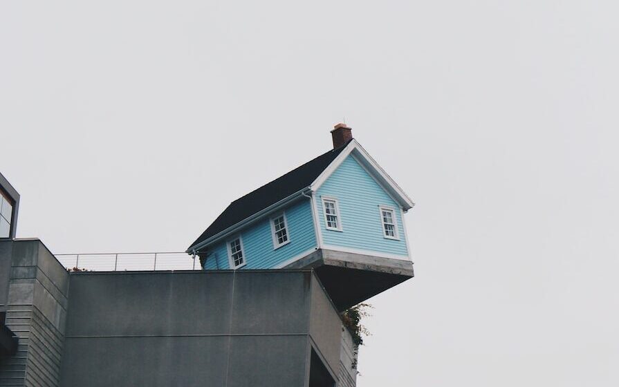 blue concrete storey house on top of building at daytime
