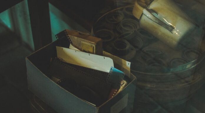 Certificate of achievement white and black box on black table