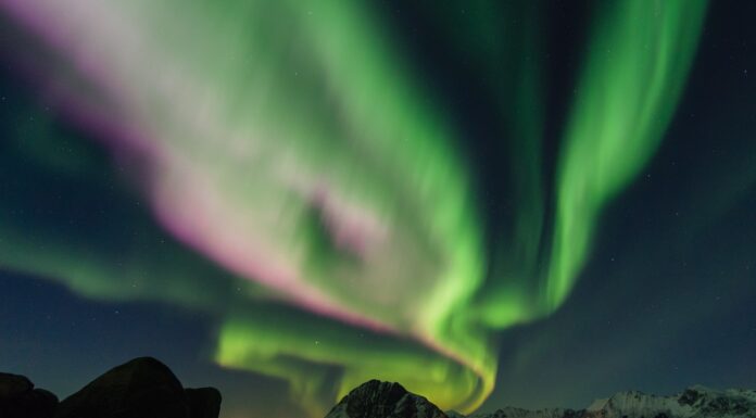 Searching for True North mountain beside body of water