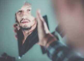 My Soul In The Mirror selective focus photography of man's reflection on a broken mirror