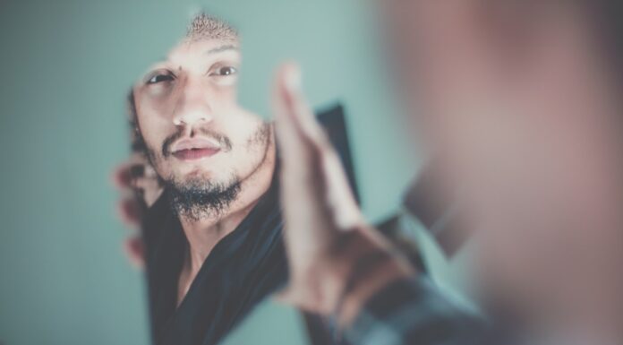 My Soul In The Mirror selective focus photography of man's reflection on a broken mirror