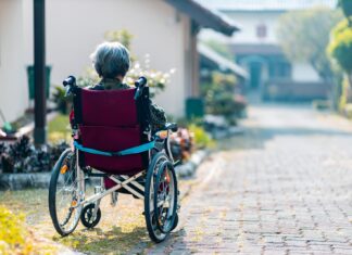 I see the sun come up and we have one more day woman sitting on wheelchair