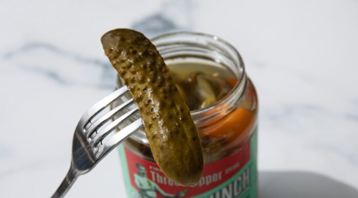 Headliner stainless steel fork on green labeled can