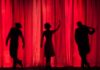 performance silhouette of three performers on stage