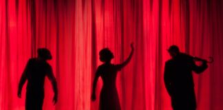 performance silhouette of three performers on stage