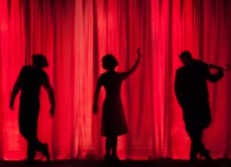 performance silhouette of three performers on stage