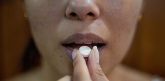 Intoxication woman putting her hand on her lips