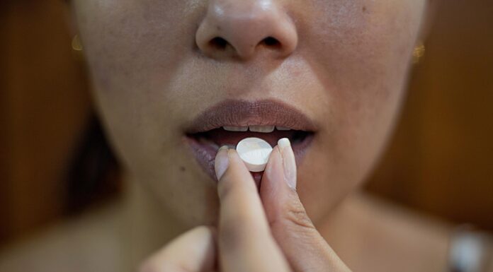 Intoxication woman putting her hand on her lips