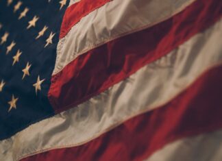 The Emigrant closeup photo of USA flag