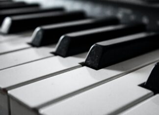 Reinbert plays Satie grayscale photography of piano