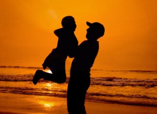 A Father’s Advice silhouette of man and woman kissing on beach during sunset