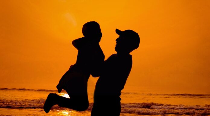 A Father’s Advice silhouette of man and woman kissing on beach during sunset