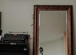 since the reading black typewriter on brown wooden table