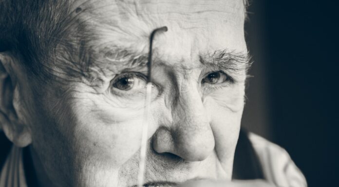 MY PAPAP IS IN THE HOSPITAL grayscale photo of a man holding eyeglasses