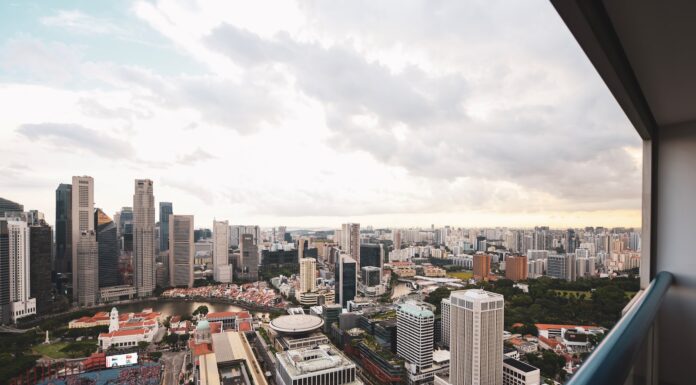 Penthouse overlooking city buildings and trees