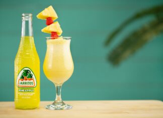 Piña Colada clear glass bottle with yellow liquid inside