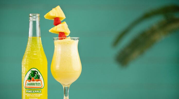 Piña Colada clear glass bottle with yellow liquid inside