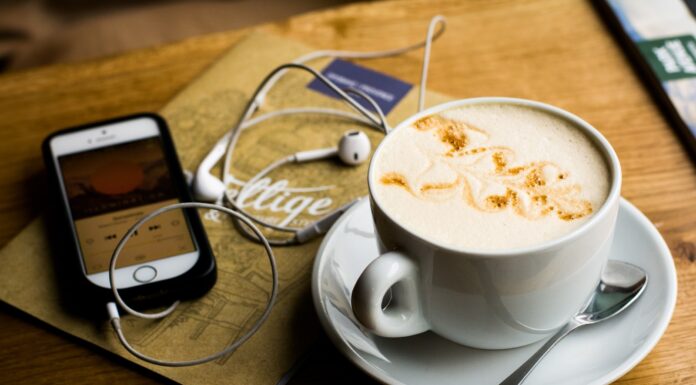 Coffee & Podcasts leaf design coffee latte on mug