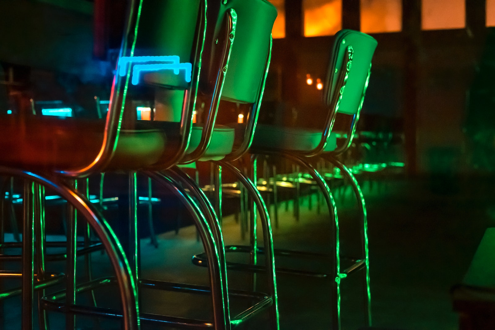 stainless steel framed green chairs
