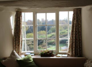 Nothing but White window curtain open wide