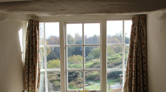 Nothing but White window curtain open wide