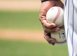 Throw Jackson man holding two white baseballs