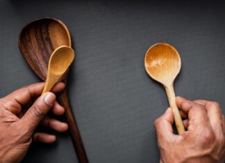 Wooden Spoons person holding brown wooden spoon