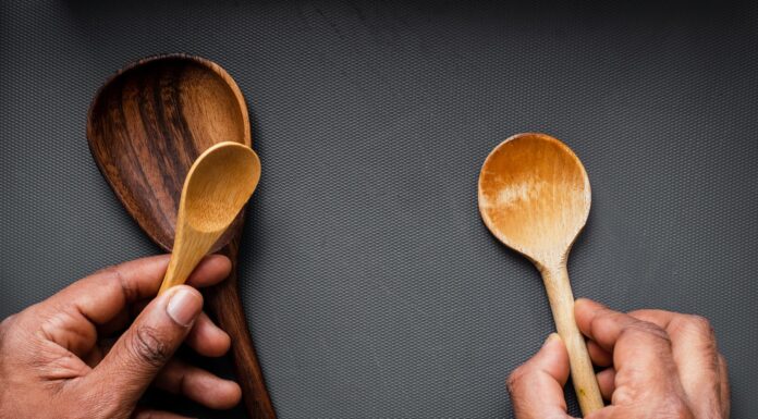 Wooden Spoons person holding brown wooden spoon
